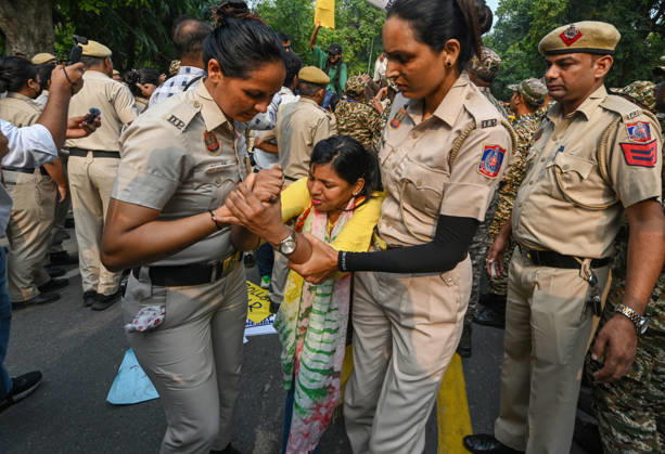 NEW DELHI, INDIA - OCTOBER 17: Delhi Police and paramilitary personnel detain members and workers of various organisations during a protest against Chief Election Commissioner Gyanesh Kumar and the Special Intensive Revision (SIR) of electoral rolls on Raisina Road on October 17, 2026 in New Delhi, India. (Photo by Raj K Raj Hindustan Times ) CJP Supporters Protest Demanding CEC Gyanesh Kumar s Resignation Over Voter List Changes