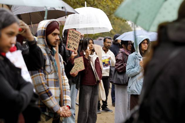 October 17, 2026, Berlin, Germany: BERLIN, GERMANY - OCTOBER 17, 2026: A small group of demonstrators hold placards at Oranienplatz in the Kreuzberg district to show solidarity with mass protests in India and to protest against the crackdown on them, as several people take the floor to discuss the situation. The demonstration followed a call by Neha Bora, president of the All India Studentsâ€⠢ Association (AISA), for people everywhere to back the protests, saying â€oeeverywhere is Jantar Mantarâ€Â, the site in Delhi where the main protests are taking place. The protests demand the resignation of Chief Election Commissioner Gyanesh Kumar over a revision of electoral rolls that opponents say led to the mass deletion of voters, whi - ZUMAq101 20261017_zna_q101_068 Copyright: xAlessiaxCoccax