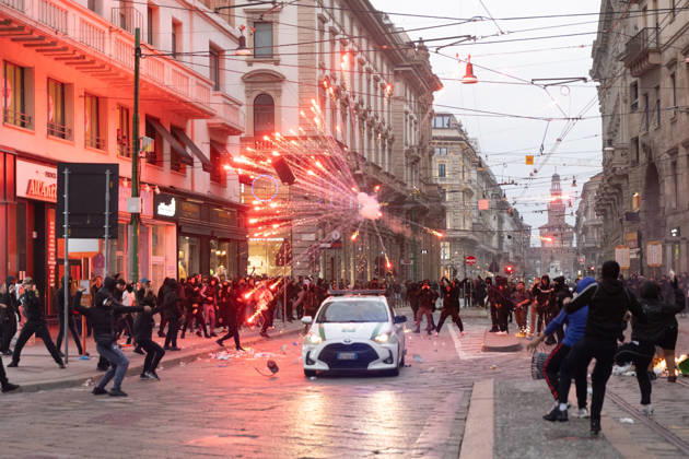 IPA89867551 - Milan, October 18, 2026: More Clashes and Looting in Downtown Milan the Day After the Protest; Pictured: A Local Police Patrol Car Under Attack  Copyright: xFrancescoxEnriquezx xFrancescoxEnriquezx IPA89867551