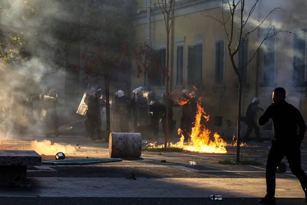 October 18, 2026, Tirana, Albania: TIRANA, ALBANIA, OCTOBER 18, 2026: Demonstrators clash with riot police in Skanderbeg Square as student-led anti-government protests continue for a sixth consecutive day. Confrontations spread from the Ministry of Education to central Tirana, with protesters throwing stones and pyrotechnics while police deploy tear gas and water cannons. Demonstrators demand improved university conditions and the resignation of Prime Minister Edi Rama. Tirana Albania - ZUMAq101 20261018_zna_q101_217 Copyright: xVlasovxSulajx