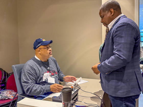 October 19, 2026, Little Rock, Arkansas, USA: Poll worker JERRY SAXTON checks in Democratic Congressional candidate CHRIS JONES so he can cast his ballot on the first day of early vote in Arkansas. Jones is running for the seat now held by Rep. French Hill (R-AR). Should Jones win, he will be the first Black person Arkansas sends to Congress. Little Rock USA  - ZUMAd155 20261019_znp_d155_025 Copyright: xSuexDorfmanx