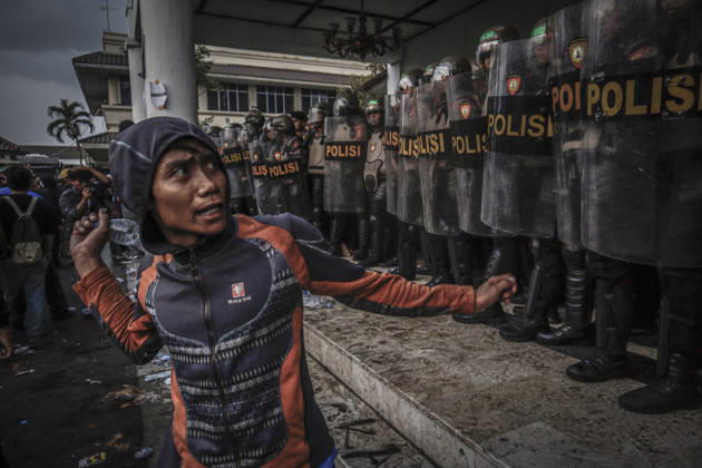 October 20, 2026, Yogyakarta, Special Region Of Yogyakarta, Indonesia: Special Region of Yogyakarta, October 20, 2026. A crowd comprising members of a community and student alliance staged a protest in front of the Special Region of Yogyakarta Regional People™s Representative Council (DPRD) building. During the protest, the demonstrators made several demands, including that forest and land fires and floods be declared national disasters; that strict action be taken against the corporations involved; and that the cost of education and healthcare be reduced and access to these services be made more equitable. Yogyakarta Indonesia - ZUMAf198 20261020_zip_f198_005 Copyright: xMuhammadxFebriansyahx