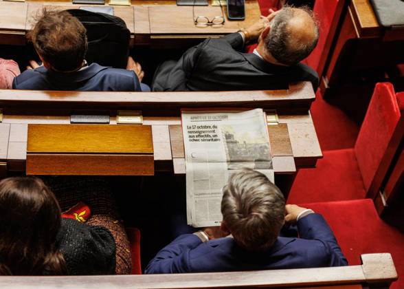 October 20, 2026: A member of parliament in the national assembly is looking at the newspaper Le Monde during the session. - ZUMAs287 20261020_zip_s287_030 Copyright: xSadakxSouicix