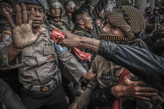 October 20, 2026, Yogyakarta, Special Region Of Yogyakarta, Indonesia: Special Region of Yogyakarta, October 20, 2026. A crowd comprising members of a community and student alliance staged a protest in front of the Special Region of Yogyakarta Regional People™s Representative Council (DPRD) building. During the protest, the demonstrators made several demands, including that forest and land fires and floods be declared national disasters; that strict action be taken against the corporations involved; and that the cost of education and healthcare be reduced and access to these services be made more equitable. Yogyakarta Indonesia - ZUMAf198 20261020_zip_f198_025 Copyright: xMuhammadxFebriansyahx