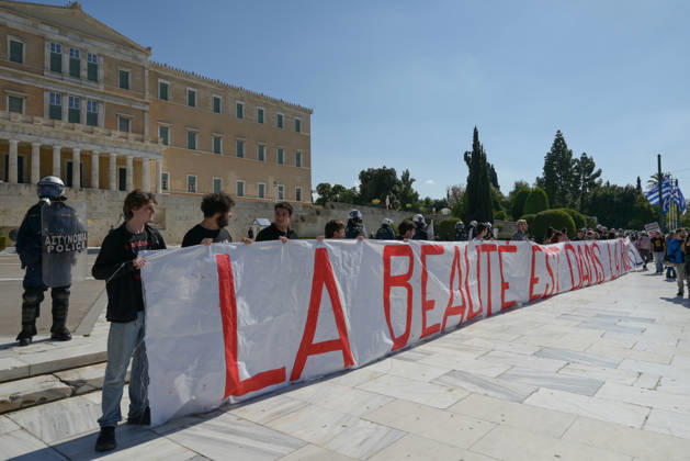 Students and teachers protest over education funding and living costs in Athens Participants hold a banner outside the Greek Parliament during a demonstration by teachers and students demanding increased funding for public education and measures to address rising living costs. Athens Greece Copyright: xNicolasxKoutsokostasxNicolasxKoutsokostasx DSC_202610210563
