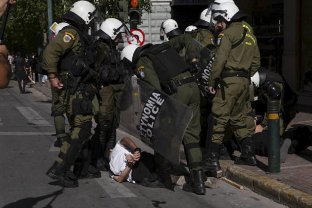 Athens Greece Living Costs Protest Riot police detain a person during a protest in Athens, Greece on October 21, 2026. Students and other demonstrators marched through central Athens to protest rising living costs and economic pressures. Organizers say the concerns raised by participants echo grievances voiced during recent demonstrations in France. Athens Attica Greece Copyright: xElvisxTakahashixMantellox