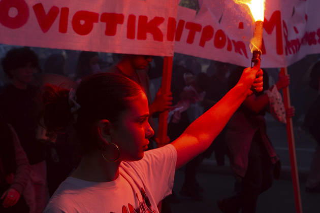 Athens Greece Living Costs Protest A protester holds a flare beside banners during a rally in Athens, Greece on October 21, 2026. Students and other demonstrators marched through central Athens to protest rising living costs and economic pressures. Organizers say the concerns raised by participants echo grievances voiced during recent demonstrations in France. Athens Attica Greece Copyright: xElvisxTakahashixMantellox