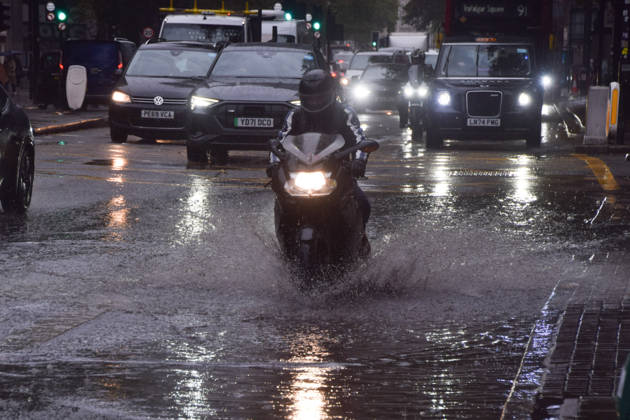 October 23, 2026, London, England, United Kingdom: A motorcyclist passes through a waterlogged Euston Road as Storm Austen brings rain to the capital. London United Kingdom - ZUMAv130 20261023_zip_v130_007 Copyright: xVukxValcicx