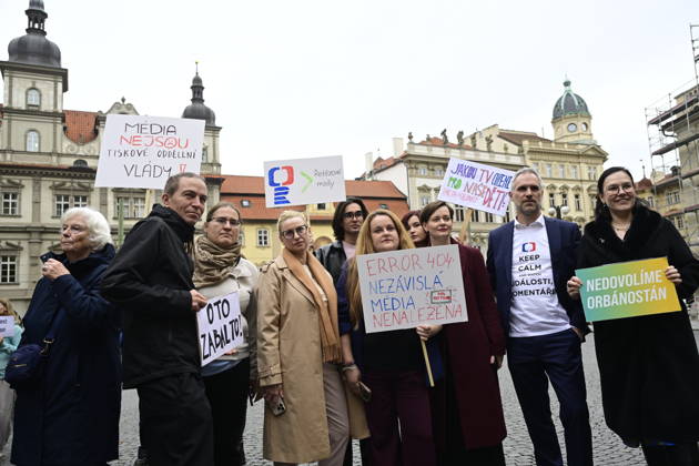 People demonstrate against the governing coalition s plan to abolish license fees for Czech Television (CT) and Czech Radio (CRo), on the Lesser Town Square, in Prague, Czech Republic, on October 23, 2026. The hastily organized protest was a response to the fact that coalition lawmakers today pushed through a motion in the Chamber of Deputies to give priority to the first reading of this bill. The second from the left is Ivan Bartos (Pirates), in the middle is Hana Ancincova (Pirates), and the second from the right is Zdenek Hrib (Pirates). (CTKxPhoto RomanxVondrous) CTKPhotoP2026102304870  CTKPhotoP2026102304870