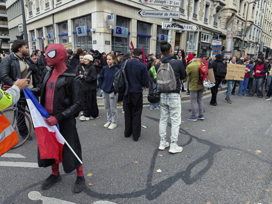 Lyon France Anti-Government Protest A demonstrator wearing a Spider-Man mask holds a French flag as protesters gather on a street in Lyon, France, on October 24, 2026. The demonstration took place amid renewed protests over living costs, wages and public services, while authorities restricted gatherings in parts of central Lyon following unrest during demonstrations the previous weekend. Lyon Rhone Alpes France Copyright: xAbolfazlxSalmanzadehx