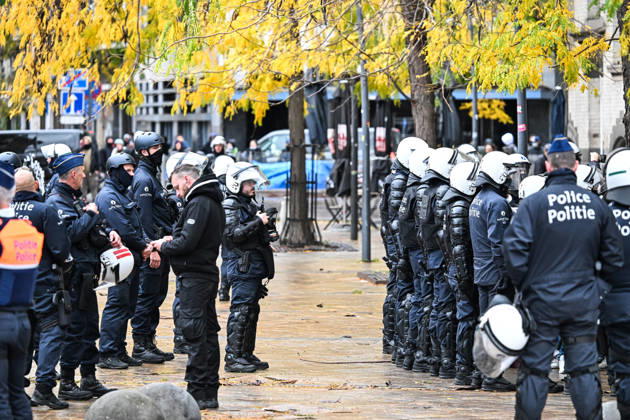 A group of riot police officers in protective equipment blocks a street during student protests in Brussels, Belgium, on 24 October 2026. Police repeatedly disperse groups of demonstrators and restrict movement through streets and avenues in central Brussels between Avenue Lemonnier and Brussels-South railway station.