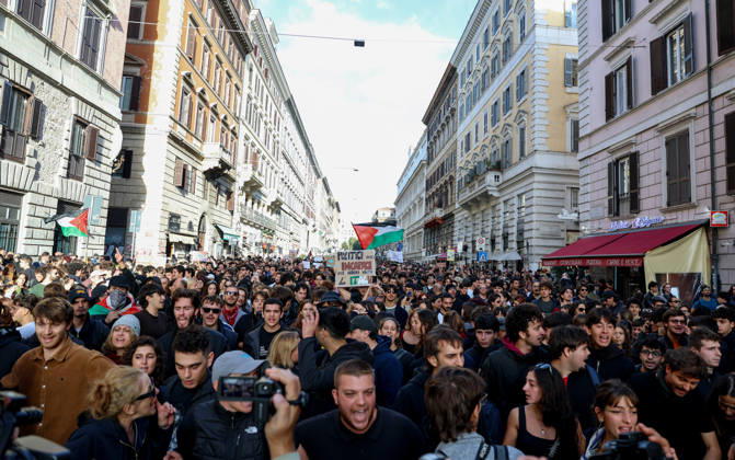 (261024) -- ROME, Oct. 24, 2026 -- Demonstrators are seen during an anti-war march in Rome, Italy, Oct. 24, 2026. Protests over rising living costs, military expansion and increased arms spending swept across several Italian cities on Saturday, with clashes between demonstrators and police reported in multiple locations. In Rome, demonstrators set off from Piazza della Repubblica, according to the ANSA news agency. Clashes erupted between protesters and police in the city center later in the evening, prompting police to use water cannons and tear gas in an attempt to disperse the crowds. ) ITALY-ROME-PROTESTS WangxKaiyan