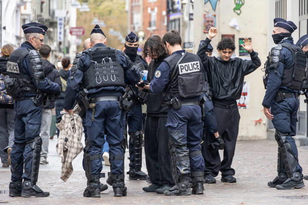 (261024) -- LILLE, Oct. 24, 2026 -- Security personnel work on the street in Lille, France, Oct. 24, 2026. Around 410,000 people took part in a new round of protests across France on Saturday, French news channel BFM TV reported, citing the Interior Ministry. (Photo by Xinhua) FRANCE-LILLE-PROTEST SebastienxCourdji 