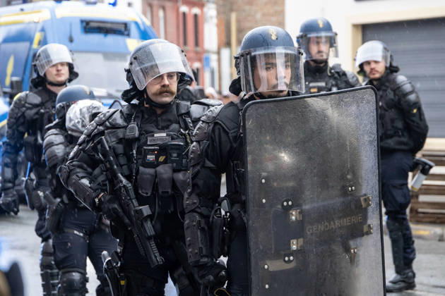 (261024) -- LILLE, Oct. 24, 2026 -- Security personnel work on the street in Lille, France, Oct. 24, 2026. Around 410,000 people took part in a new round of protests across France on Saturday, French news channel BFM TV reported, citing the Interior Ministry. (Photo by Xinhua) FRANCE-LILLE-PROTEST SebastienxCourdji 