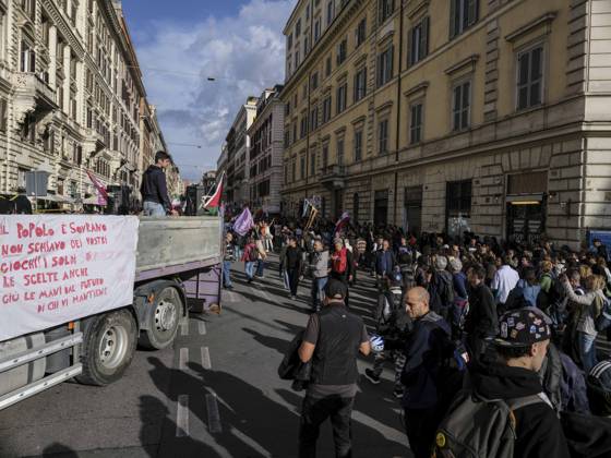 Rome Anti War Protest Demonstrators gather near a vehicle during an anti-war protest in Rome, Italy on October 24, 2026. Demonstrators took part in an anti-war march under the slogan Keep Italy Out of the War . Protesters further voiced opposition to Italy s involvement in armed conflicts, military rearmament and government policies. Rome Lazio Italy Copyright: xAndreaxCalandrax