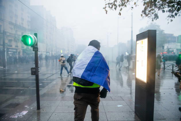 October 24, 2026, Paris, Abruzzo, Italy: Paris, the second act of the protests against the increasing of the cost of living ends up in clashes with police. Very strict security measures were adopted, but tensions erupted in clashes, tear gas and water cannons. Student wearing a france flag. Paris Italy - ZUMAb283 20261024_zaf_b283_011 Copyright: xSebastianoxBaccix