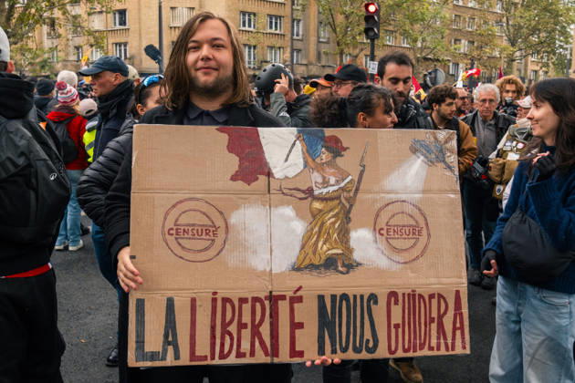 Yellow Vests Protest Act II - Paris Demonstrators carry placards displaying political messages during a march against the rising cost of living and for social justice in Paris, France, on October 24, 2026. The protest follows the boulevards des Maréchaux from Porte d’Italie to Porte de Vincennes, with calls for higher wages and better funding for public services and education. Photo by Jules Bernard ABACAPRESS.COM Paris Île-de-France France  Copyright: xBernardxJules ABACAx
