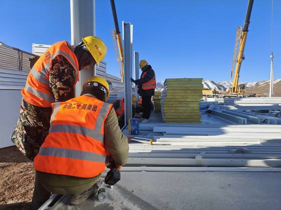 (261025) -- BAQEN, Oct. 25, 2026 () -- Rescuers from the China Railway 20th Bureau Group Corporation Limited build prefabricated houses at a quake-hit village in Gangchen Township of Baqen County, Nagqu City, southwest China s Xizang Autonomous Region, Oct. 25, 2026. Rescue and relief efforts continue after a 7.0-magnitude earthquake struck Baqen County of the city of Nagqu in southwest China s Xizang Autonomous Region, local authorities said Saturday. The roof panels of the first batch of prefabricated houses have been installed in Sunday afternoon in the quake-hit village in Gangchen Township of Baqen, and the laying of cables and the installation of doors and windows have been advanced successively. Currently, seven prefabricated houses 