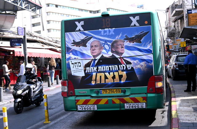 An election campaign poster for Prime Minister Benjamin Netanyahu with U.S. President Donald Trump and fighter jets, reads in Hebrew We Have One Chance To Win is seen on the back of a bus in Jerusalem on Sunday, October 25, 2026. According to the latest election polls, Gadi Eisenkot s Yashar Party leads Prime Minister Benjamin Netanyahu s Likud Party two days before the election. Israelis will head to the polls on October 27 to vote in the first general election since the Hamas massacre on October 7, 2023.  JER2026102516 DEBBIExHILL